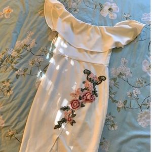 Off the shoulder dress w/pink flower accents.